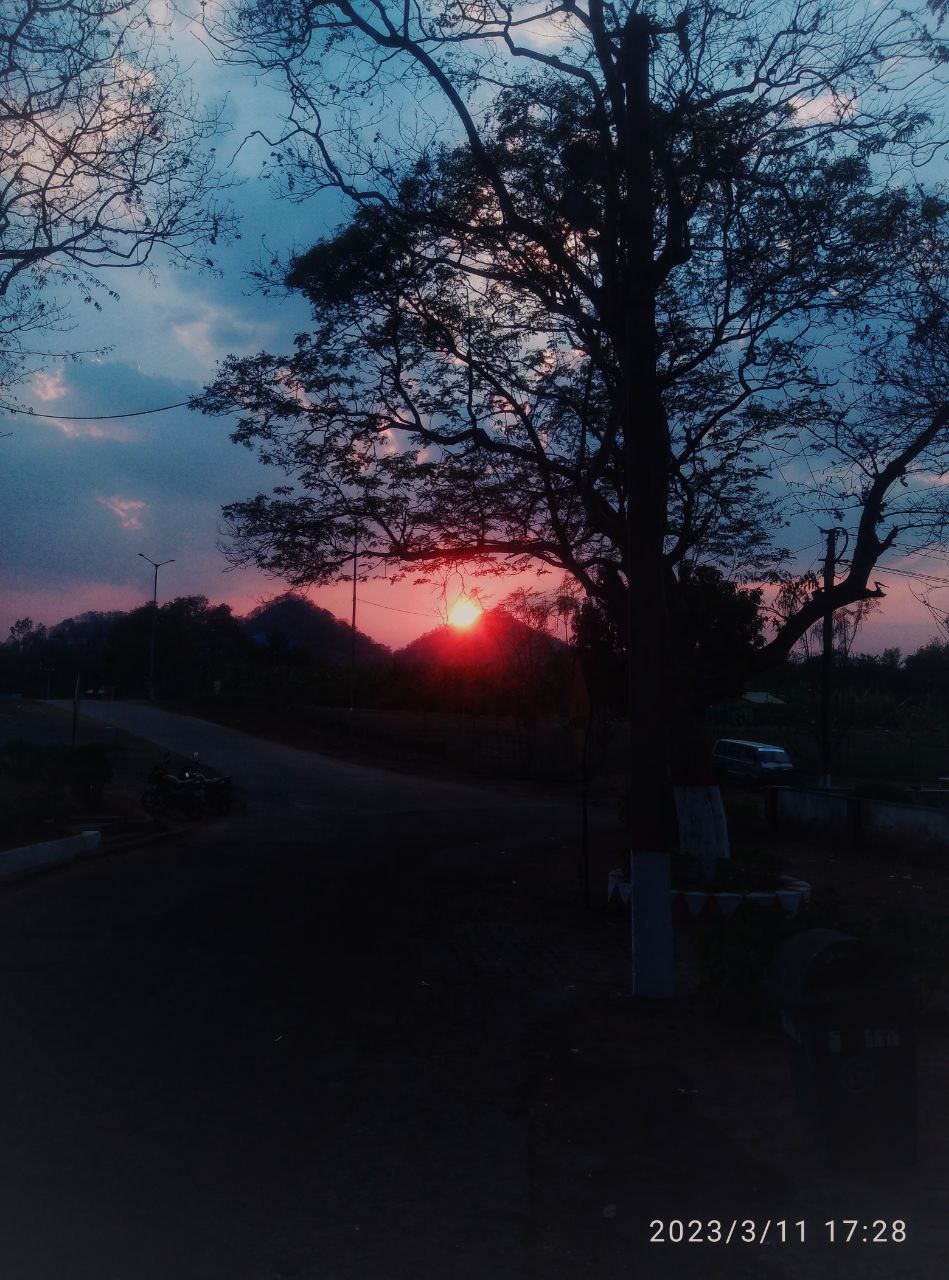 a sunset over a street